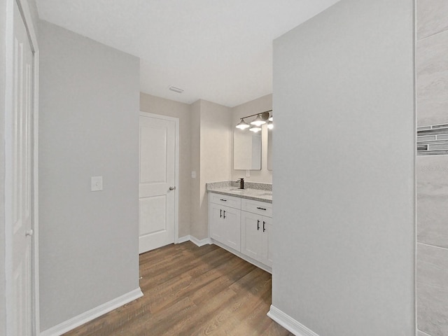 bathroom featuring vanity and hardwood / wood-style floors