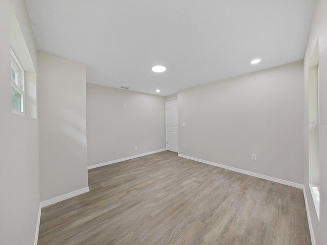 unfurnished room featuring light hardwood / wood-style floors