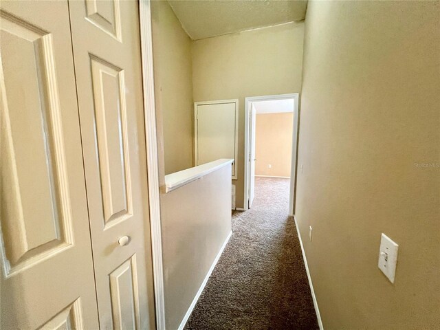 corridor with carpet flooring