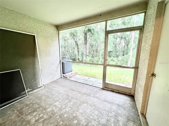 unfurnished sunroom featuring plenty of natural light