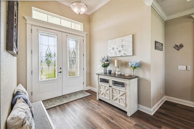 entrance foyer featuring hardwood / wood-style flooring, french doors, and crown molding