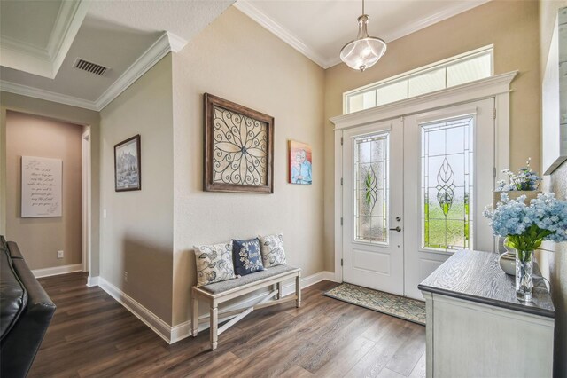 foyer with dark wood-type flooring and ornamental molding