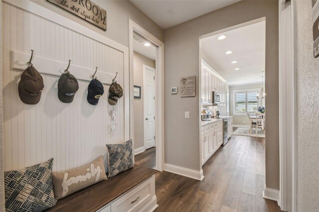 mudroom with dark hardwood / wood-style floors