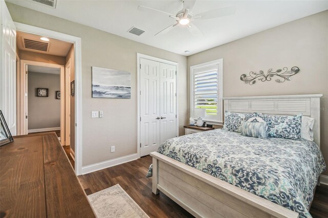 bedroom with ceiling fan, a closet, and dark hardwood / wood-style flooring