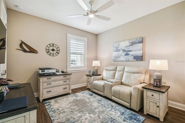 living room with ceiling fan and dark wood-type flooring