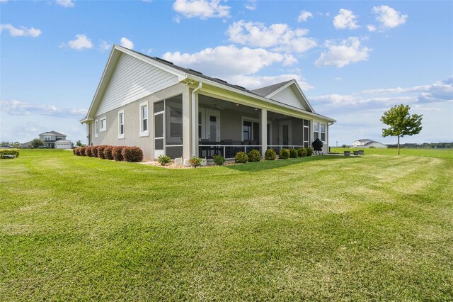 back of house featuring a lawn