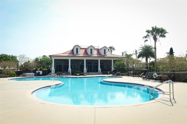 view of swimming pool with a patio area