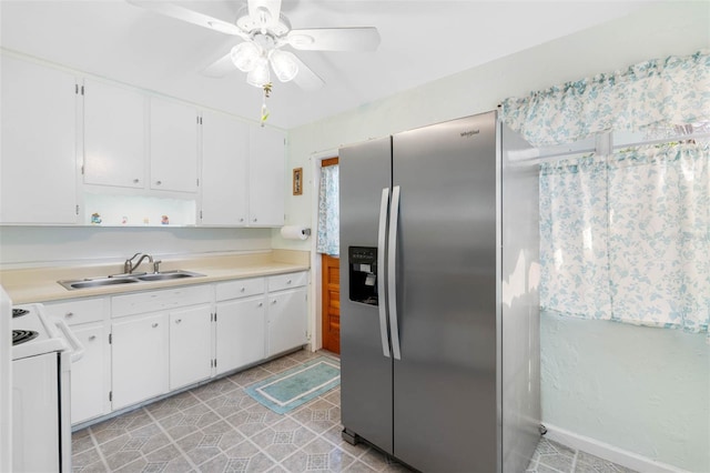 kitchen with white range with electric stovetop, white cabinetry, a sink, and stainless steel fridge with ice dispenser