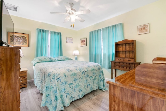 bedroom featuring light wood-type flooring and ceiling fan