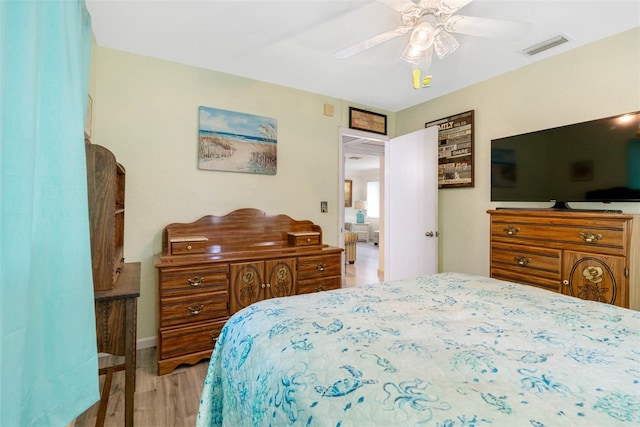 bedroom with ceiling fan and light hardwood / wood-style floors