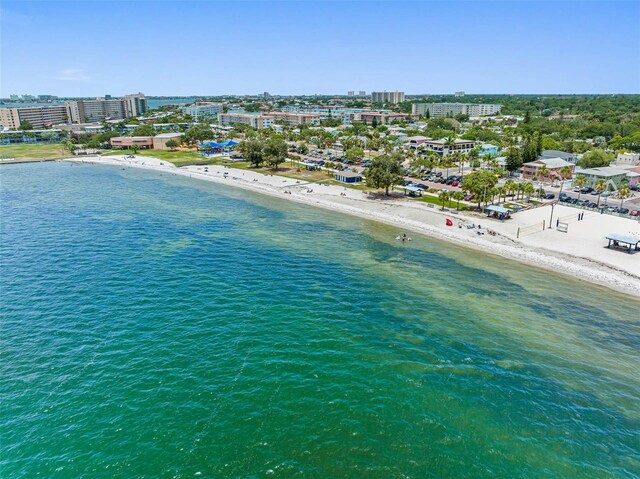 drone / aerial view featuring a view of the beach and a water view