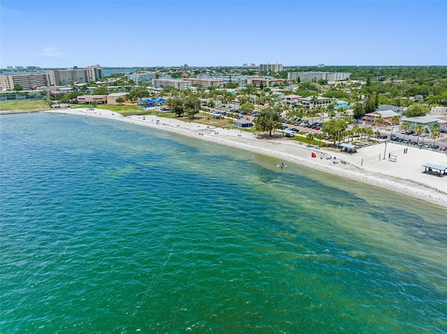 birds eye view of property featuring a view of the beach, a water view, and a view of city