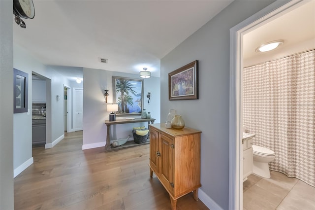 hall featuring hardwood / wood-style floors