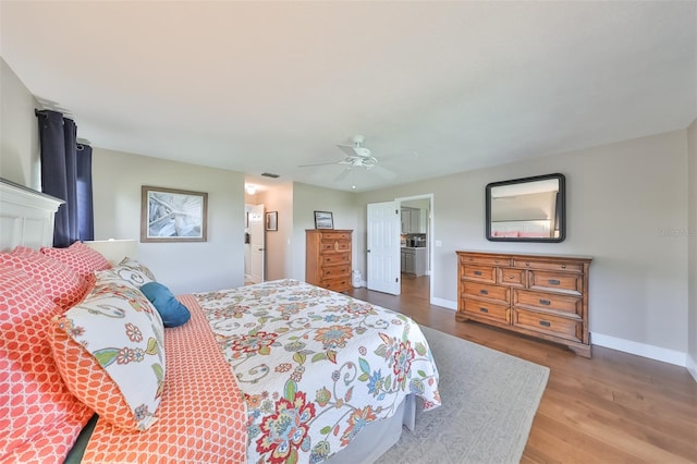 bedroom with ceiling fan and wood-type flooring