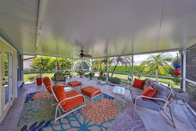 sunroom / solarium featuring ceiling fan and a wealth of natural light