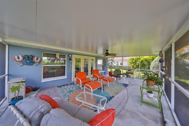 sunroom featuring ceiling fan, french doors, and plenty of natural light