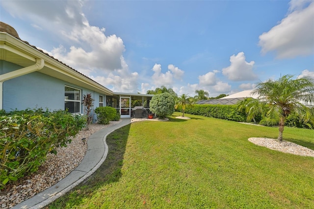 view of yard with a sunroom