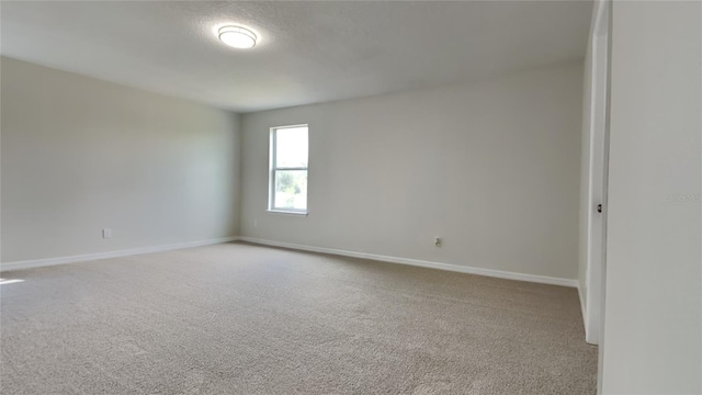 unfurnished room featuring carpet floors