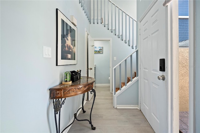 entrance foyer featuring light wood-type flooring and stairway