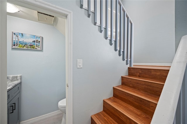 stairs featuring baseboards