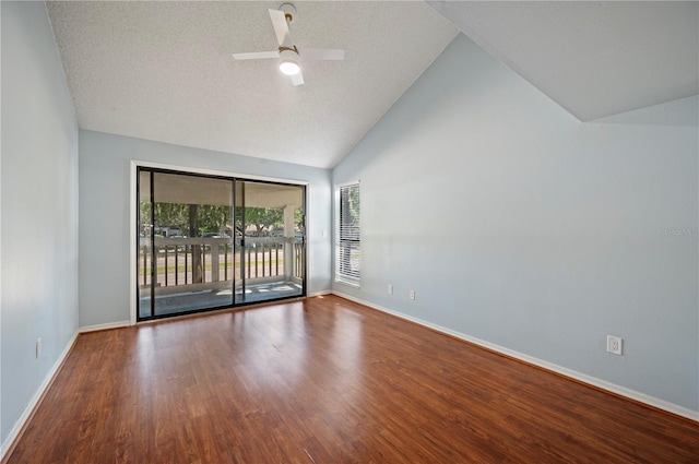 spare room with ceiling fan, a textured ceiling, wood finished floors, high vaulted ceiling, and baseboards