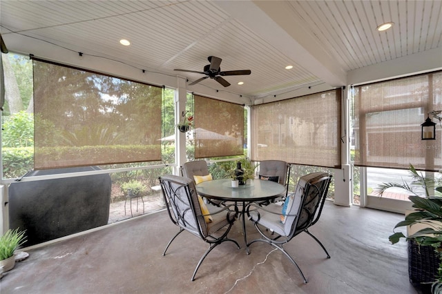 sunroom / solarium featuring ceiling fan