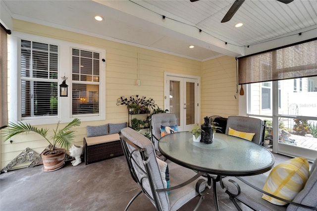 sunroom / solarium featuring ceiling fan