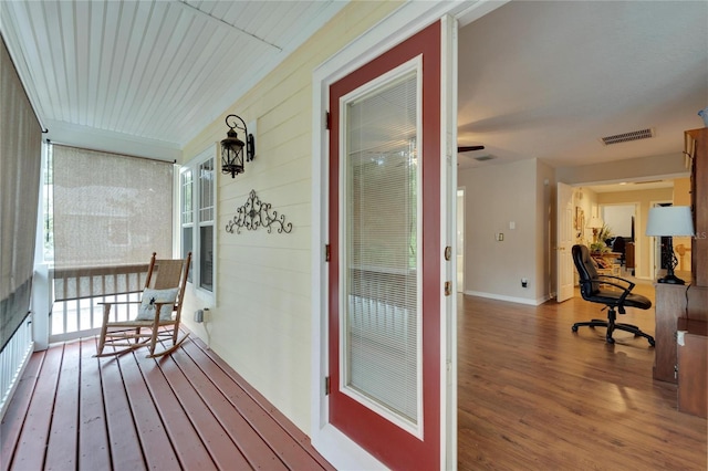 deck featuring covered porch and visible vents