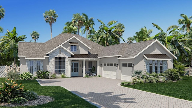 view of front of house with a garage and a front yard