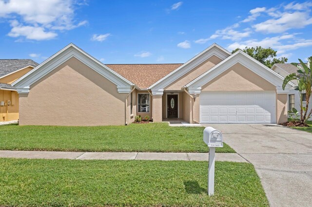 ranch-style home with a front yard and a garage