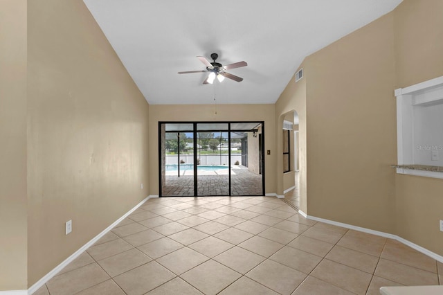 tiled empty room with ceiling fan