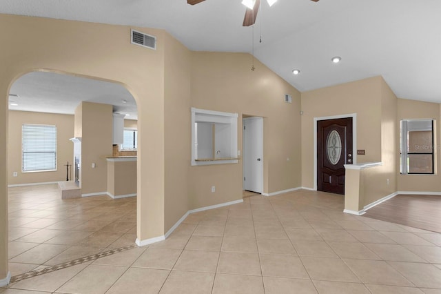 interior space featuring ceiling fan, high vaulted ceiling, and light hardwood / wood-style floors