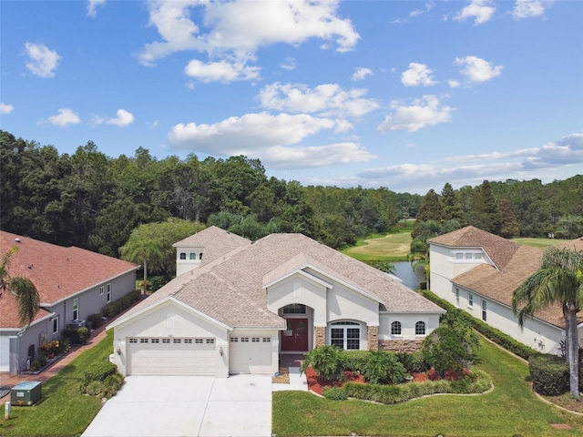 view of front of home featuring concrete driveway, central AC, a garage, stone siding, and a front lawn