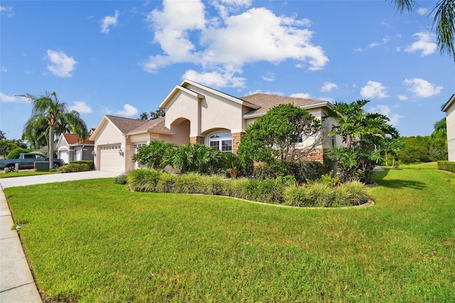 view of front facade with a front yard and a garage