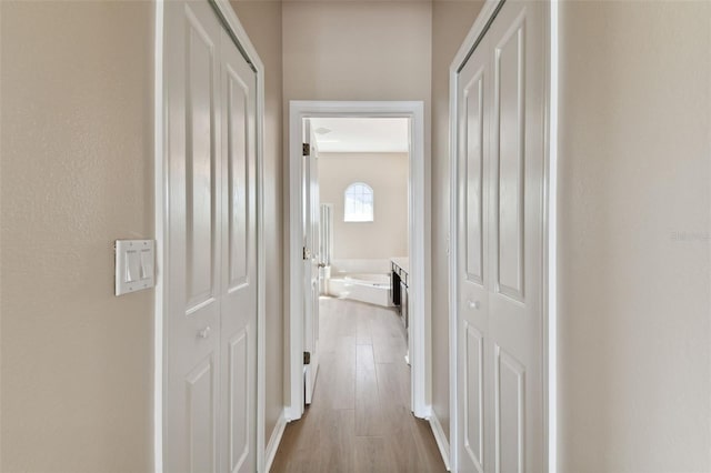 corridor featuring light wood-type flooring