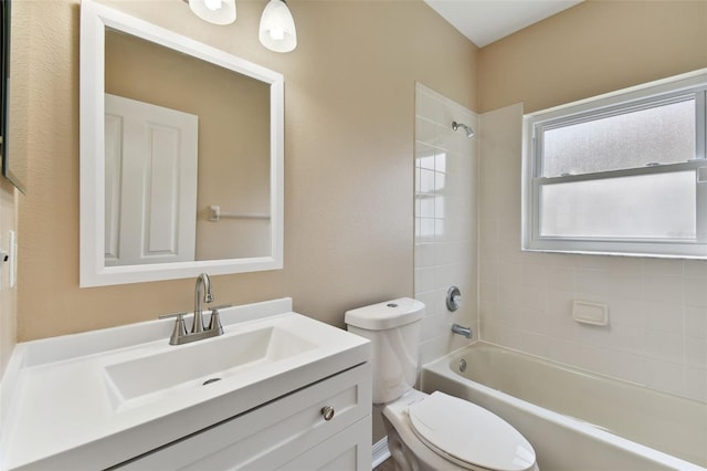 bathroom featuring toilet, vanity, and washtub / shower combination