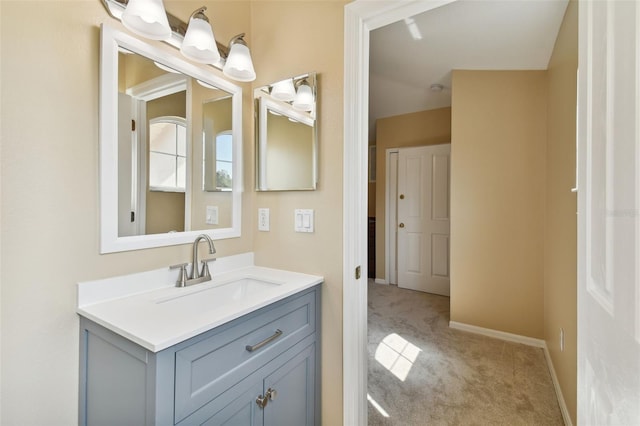 bathroom featuring baseboards and vanity