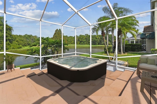 sunroom / solarium with a water view