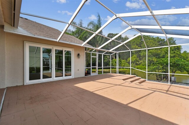 view of patio / terrace featuring a lanai