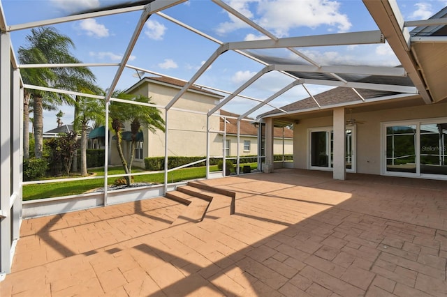 view of patio / terrace featuring a lanai and a ceiling fan