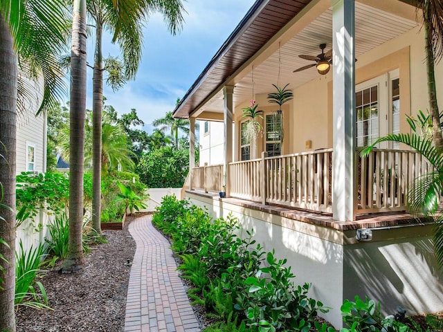 view of home's exterior featuring ceiling fan and covered porch