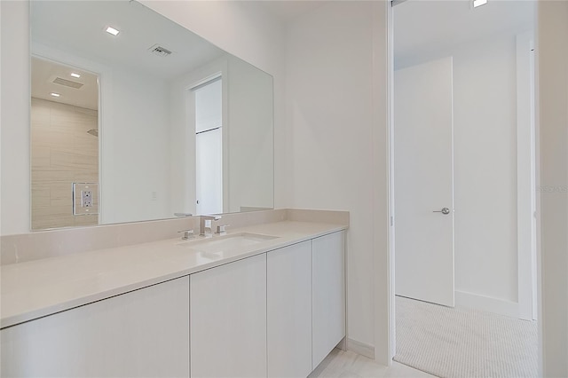 bathroom featuring visible vents and vanity