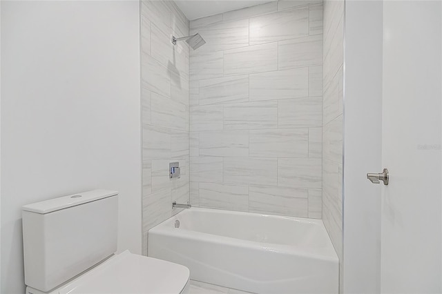 bathroom featuring toilet and bathing tub / shower combination