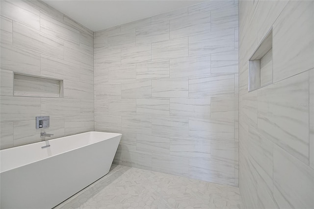 bathroom featuring a soaking tub