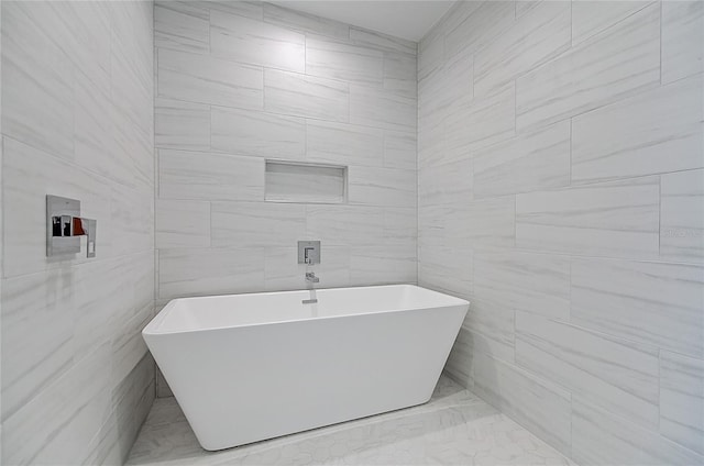 bathroom with a freestanding tub