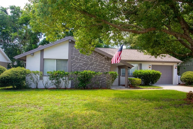 ranch-style house with a garage and a front lawn