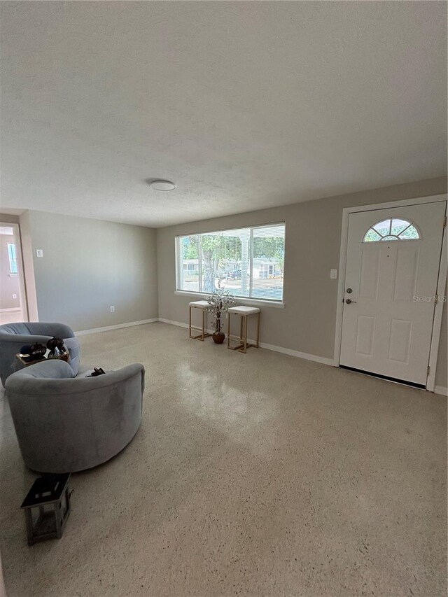 living room featuring a textured ceiling