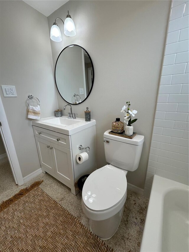 bathroom featuring vanity, toilet, and a bathtub