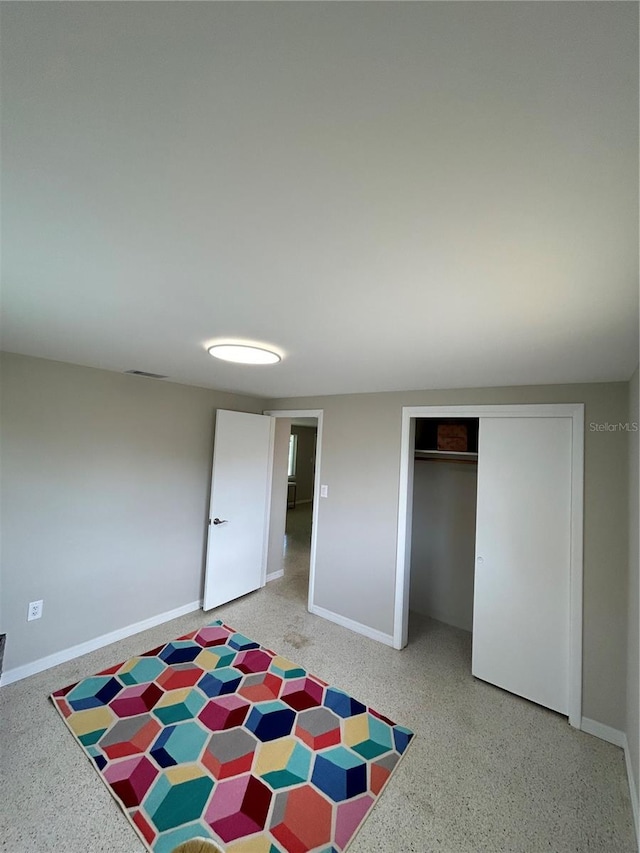 unfurnished bedroom featuring a closet