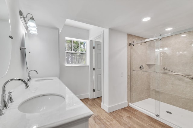 bathroom with walk in shower and vanity